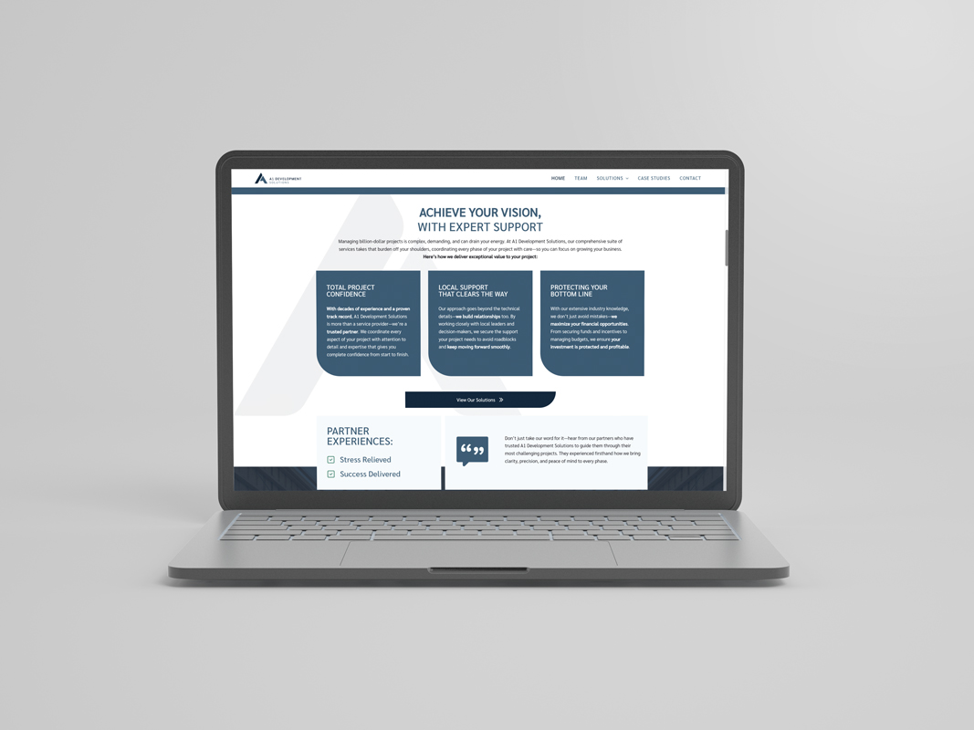 A1 Development Solutions website displayed on laptop